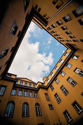 building low-angle photography of yellow concrete building architecture