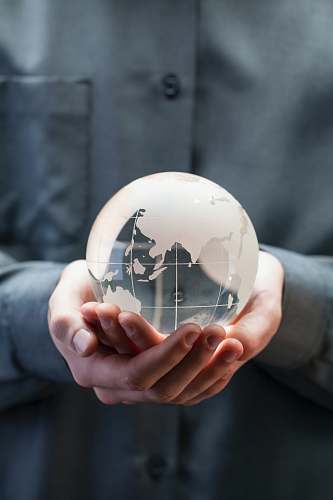 clothing shallow focus photo of clear glass globe table ornament helmet