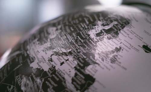 globe grayscale photo of desk globe outer space