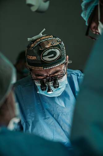 clothing doctor wearing Green Bay Packers hat helmet