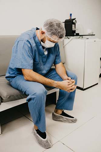 shoe man sitting on grey sofa footwear