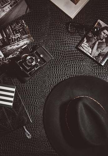 hat camera beside black hat photo