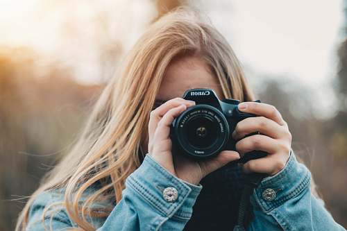 human woman taking photo during daytime person