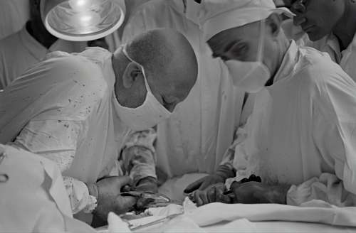 hospital doctors doing operation black-and-white