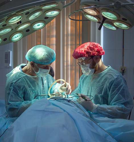 clinic two men wearing blue lab coats hospital