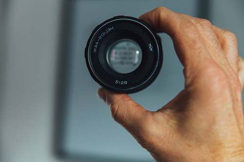 lens person holding camera lens camera