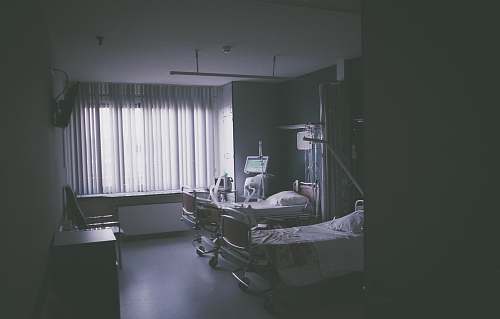 medical grayscale photography of nursing bed grey