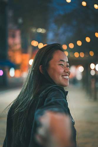 person follow me photography of smiling woman smile