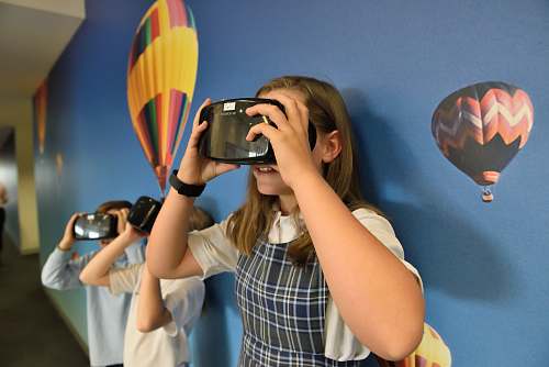 person girl wearing VR headset photography