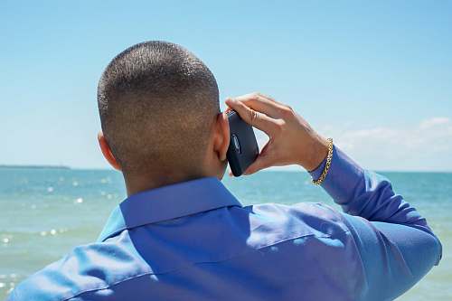 person man holding phone photo