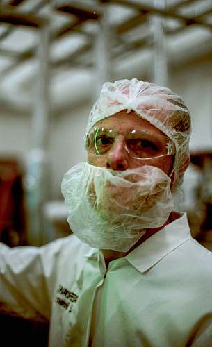 person man standing while wearing face mask plastic wrap