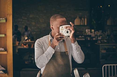 person man using camera camera