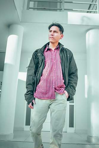 apparel man wearing grey zip-up jacket clothing