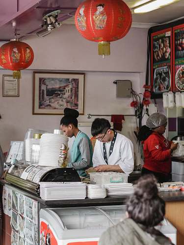 person people behind counter table people