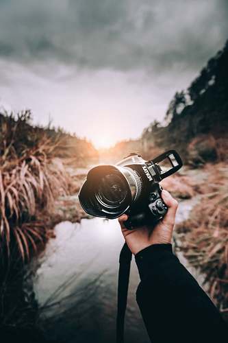 person person holding camera camera