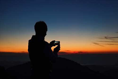 person person taking photography of mountain mont caume