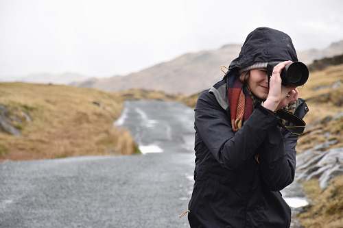person photo of woman taking pictures people