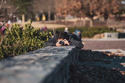 person pruning man taking photo photographer