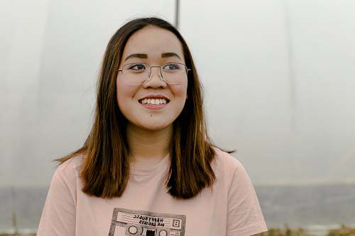 people selective focus photograph of woman in pink crew-neck t-shirt person