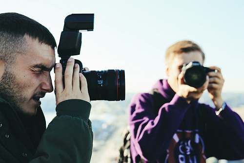 person two men taking photo photographer