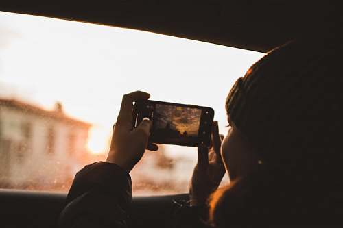 person woman holding Android smartphone photo