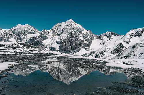 mountain mountain coated with snow snow