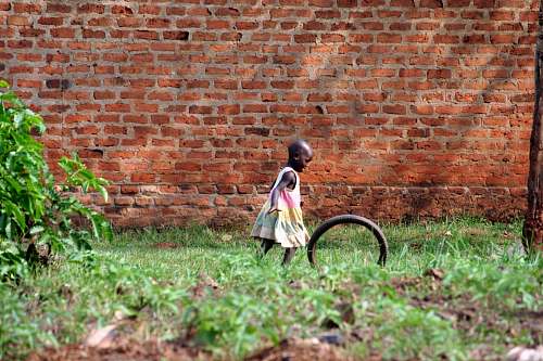 brick girl playing bike wheel child