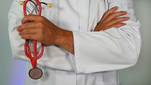 doctor doctor holding red stethoscope person