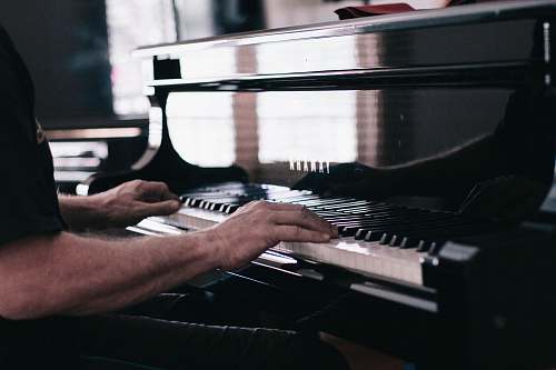 piano person playing piano musical instrument