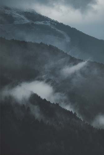 grey mountain covered by fog isolaccia