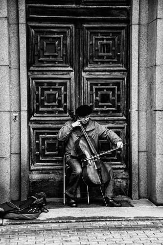 human illustration of person playing cello black-and-white