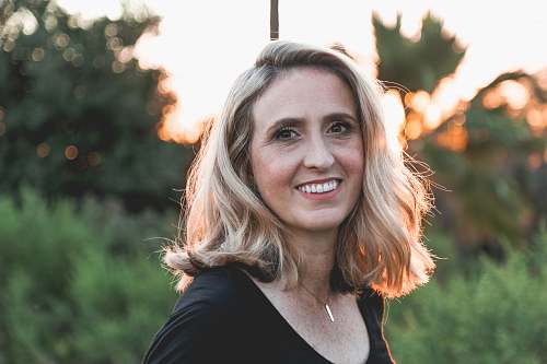 human smiling woman in shallow focus photography woman