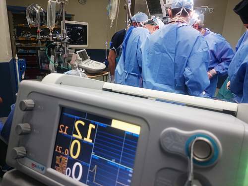 human doctors doing surgery inside emergency room medical