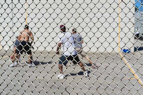 people four men playing basketball human