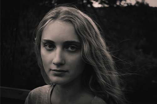 human greyscale photo of woman wearing shirt face