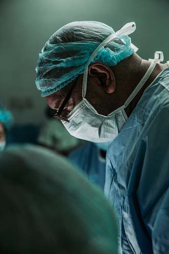 human man wearing medical mask and robe clinic