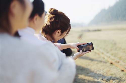 human people taking groufie photo