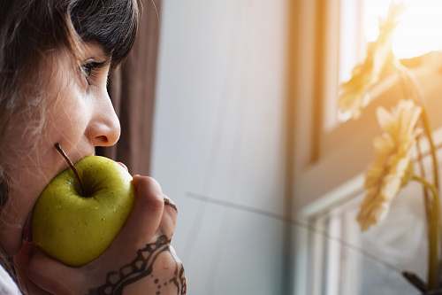human woman biting apple people