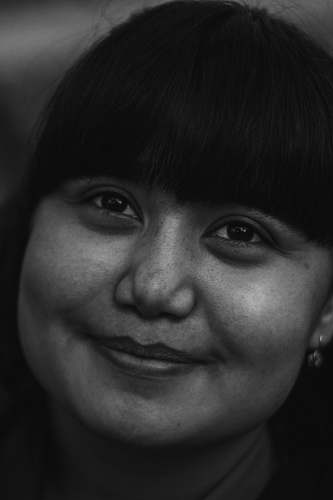 black-and-white woman smiling and looking up face