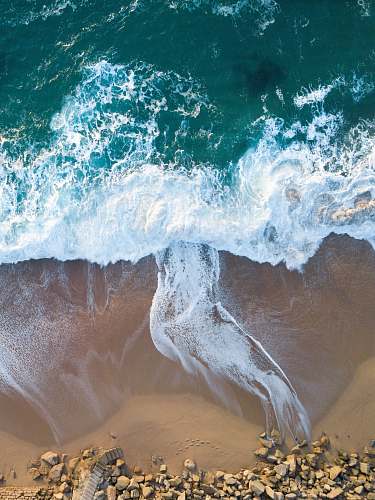 water top view of ocean wave on seashore sea