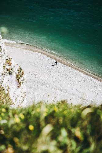 france aerial photography of a human on seashore beach