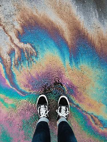 footwear person standing on oil spilled surface shoe