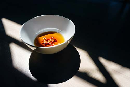 bowl white ceramic bowl on wooden surface ho chi minh city