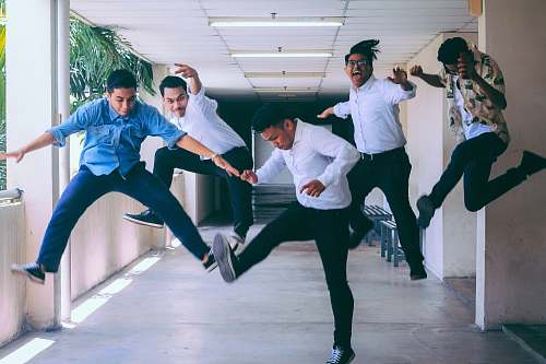human group of people doing jump shot photography person