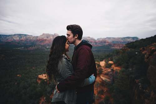 nature man kissing woman's forehead love