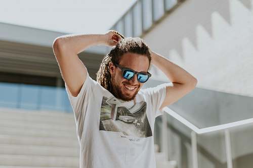 human man tying his hair walking on stairs person