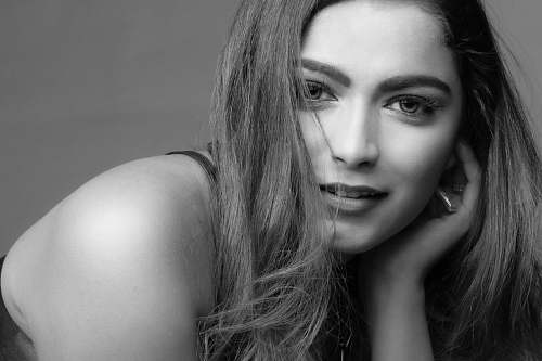 human grayscale photo of woman face