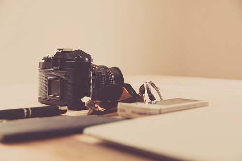 electronics black DSLR camera hip
