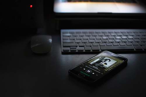 mouse smartphone beside keyboard computer