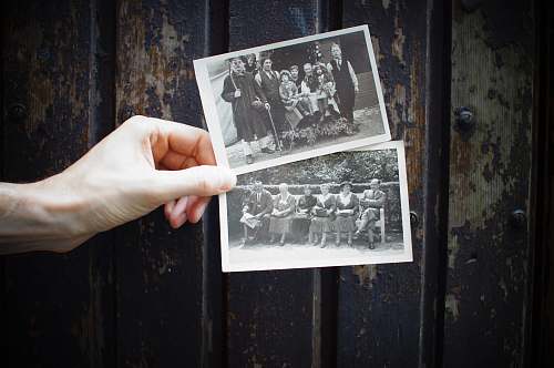blackboard person holding vintage photos vintage